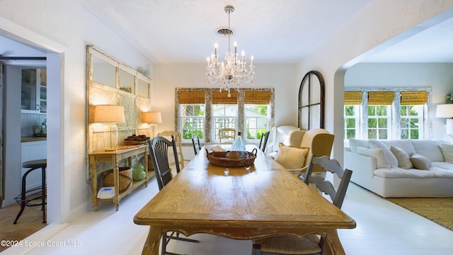 dining space with a notable chandelier