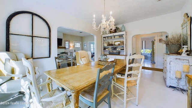 dining room with a wealth of natural light and a chandelier