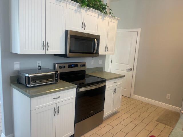 kitchen featuring white cabinets and stainless steel appliances