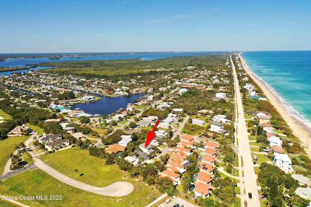 aerial view with a water view and a view of the beach