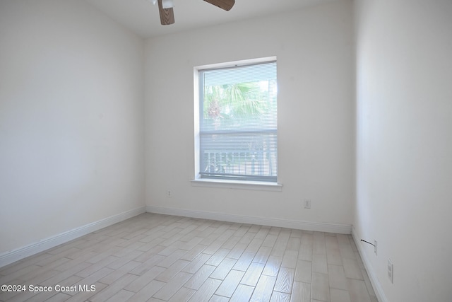 unfurnished room featuring light hardwood / wood-style flooring and ceiling fan