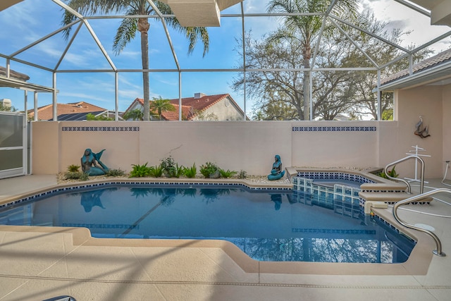 view of swimming pool featuring an in ground hot tub and glass enclosure