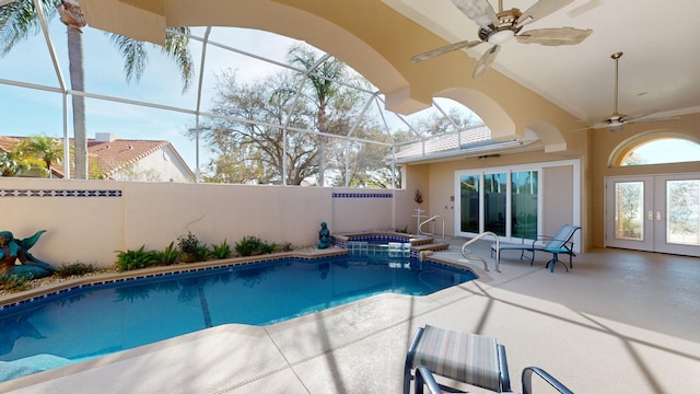 view of pool with a lanai, an in ground hot tub, french doors, and ceiling fan