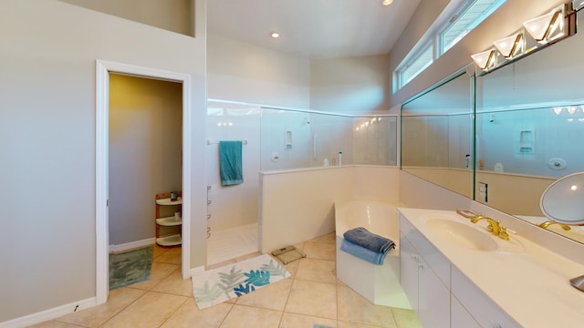 bathroom with tile patterned flooring, vanity, and independent shower and bath