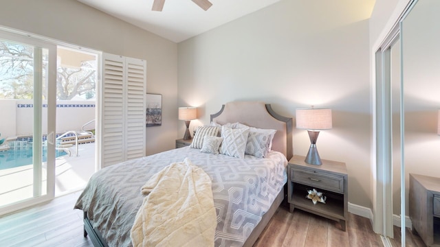 bedroom with a closet, access to outside, light hardwood / wood-style flooring, and ceiling fan