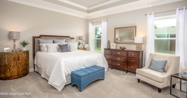 bedroom featuring crown molding and light colored carpet