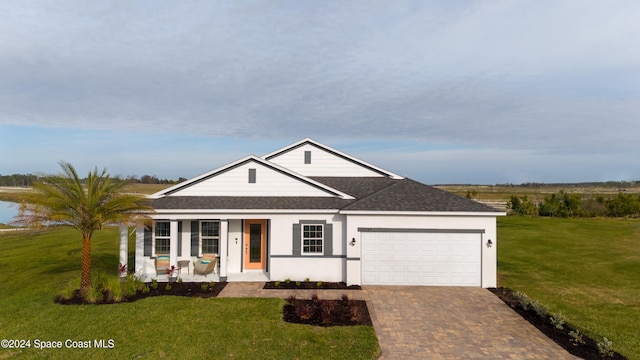 ranch-style house with a front yard, a porch, and a garage