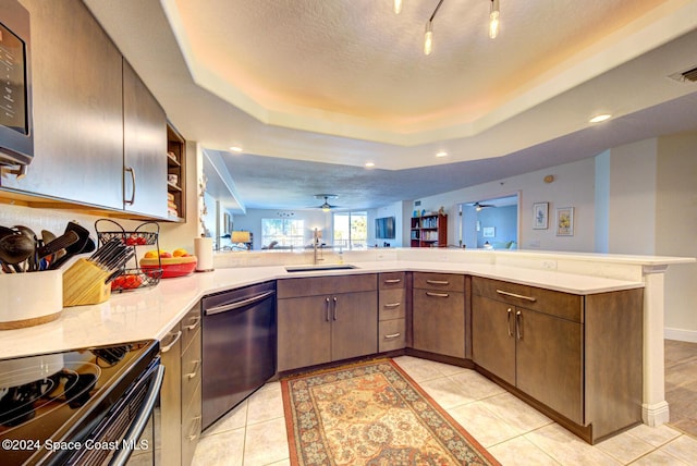 3360 S Atlantic Ave Unit 212, Cocoa Beach, FL 32931 - kitchen with dishwasher, a sink, black range with electric stovetop, light countertops, and open shelves
