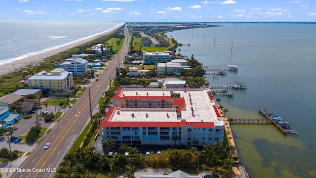 birds eye view of property featuring a view of the beach and a water view