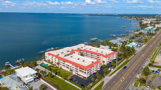 birds eye view of property with a water view