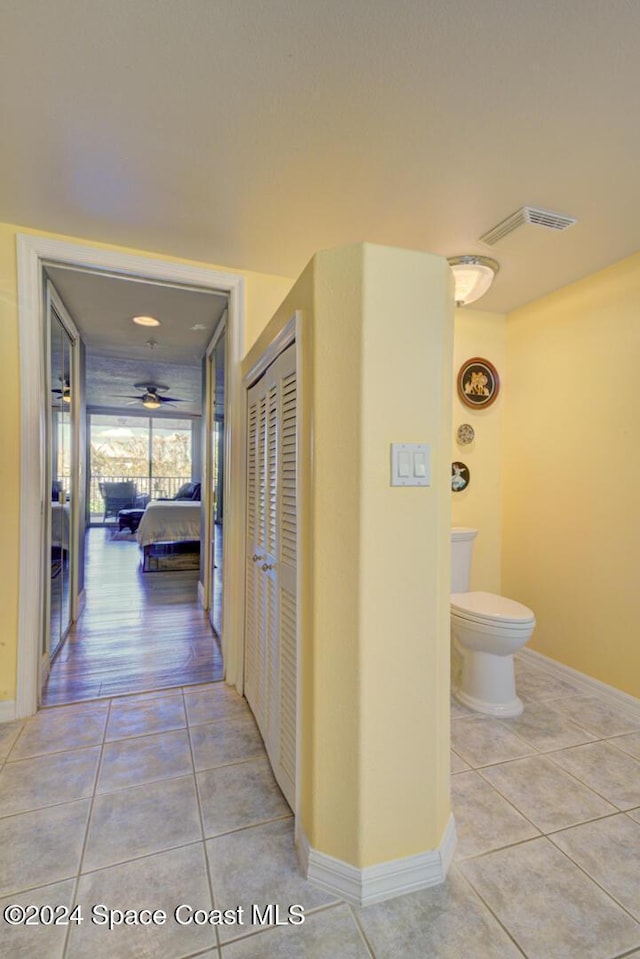 3360 S Atlantic Ave Unit 212, Cocoa Beach, FL 32931 - hallway with light tile patterned floors and baseboards