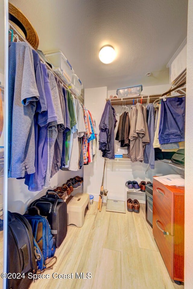 spacious closet featuring light wood-type flooring