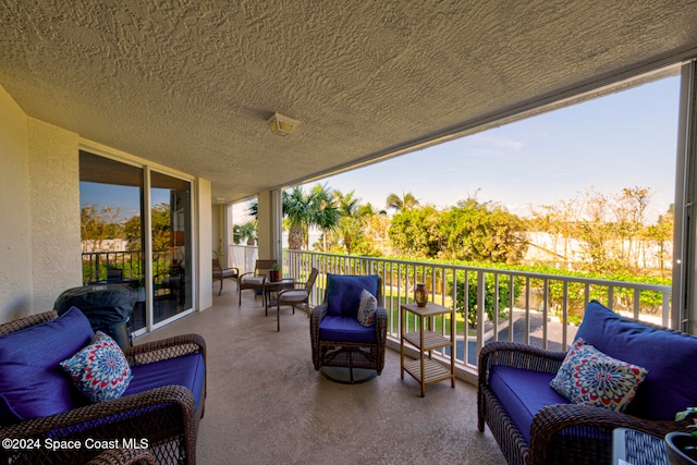 view of patio featuring a balcony