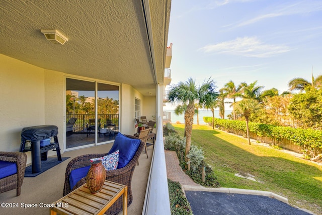 3360 S Atlantic Ave Unit 212, Cocoa Beach, FL 32931 - view of patio / terrace featuring a water view and outdoor lounge area