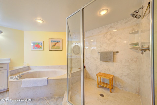 bathroom featuring vanity, tile patterned floors, and separate shower and tub