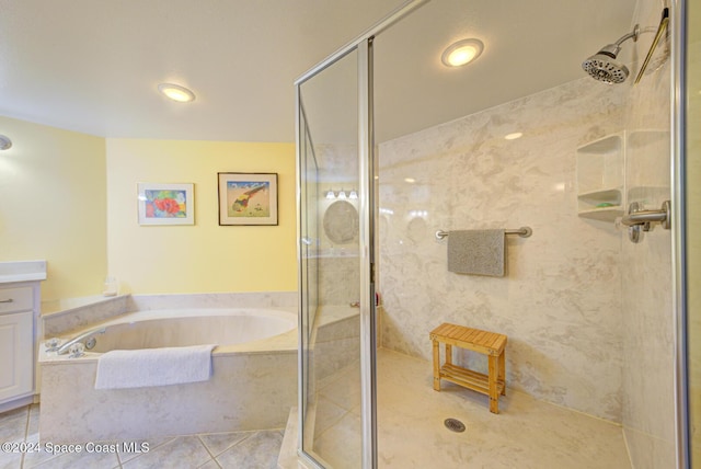 3360 S Atlantic Ave Unit 212, Cocoa Beach, FL 32931 - bathroom featuring a shower stall, tile patterned flooring, a garden tub, vanity, and recessed lighting