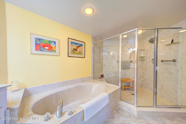 bathroom featuring tile patterned flooring, separate shower and tub, and vanity