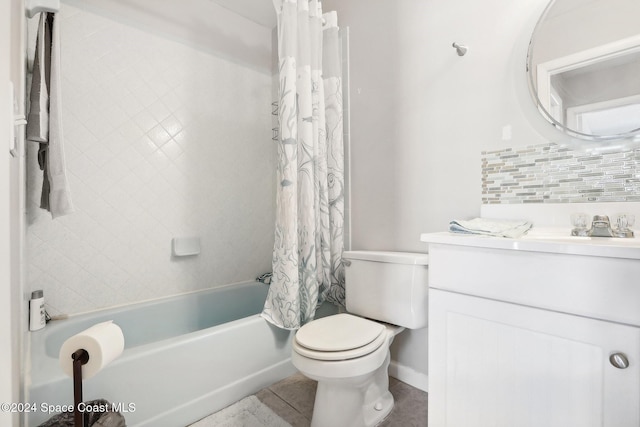 full bathroom featuring tasteful backsplash, toilet, vanity, shower / tub combo with curtain, and tile patterned floors