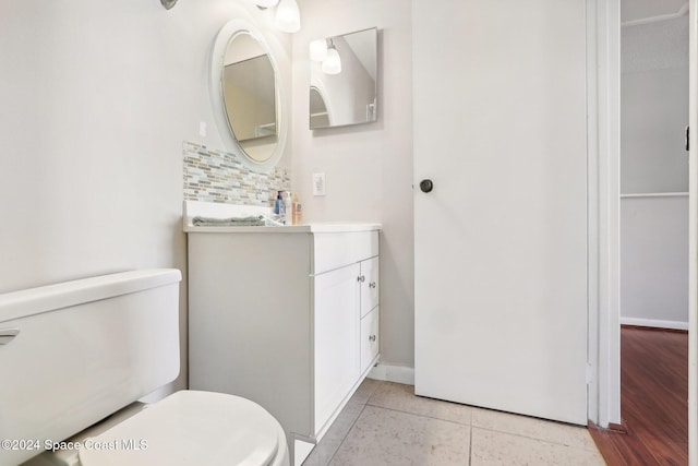 bathroom featuring vanity, toilet, and tile patterned floors