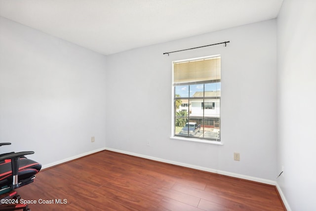 empty room featuring hardwood / wood-style flooring