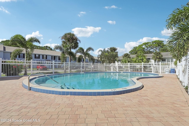 view of swimming pool featuring a patio