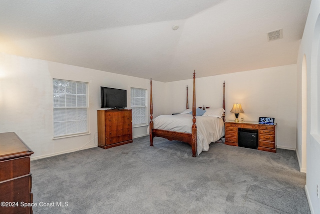 carpeted bedroom featuring vaulted ceiling