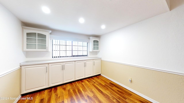 753 Greenwood Manor Cir Unit 15B, West Melbourne, FL 32904 - unfurnished room with wood finished floors, recessed lighting, and baseboards