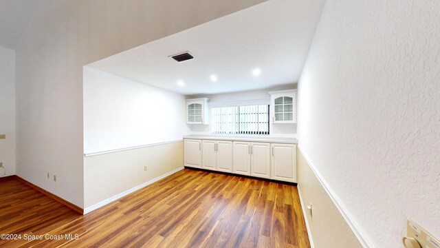 753 Greenwood Manor Cir Unit 15B, West Melbourne, FL 32904 - empty room with wood finished floors, baseboards, and recessed lighting