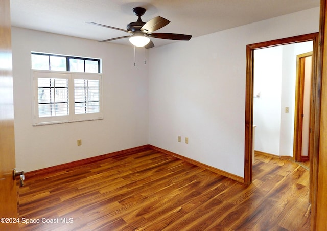 753 Greenwood Manor Cir Unit 15B, West Melbourne, FL 32904 - spare room with wood finished floors, a ceiling fan, and baseboards