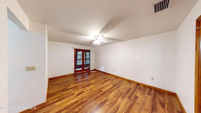 753 Greenwood Manor Cir Unit 15B, West Melbourne, FL 32904 - spare room with wood finished floors, ceiling fan, baseboards, and french doors