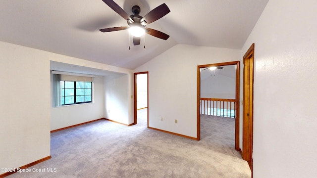 753 Greenwood Manor Cir Unit 15B, West Melbourne, FL 32904 - empty room featuring ceiling fan, vaulted ceiling, carpet flooring, and baseboards