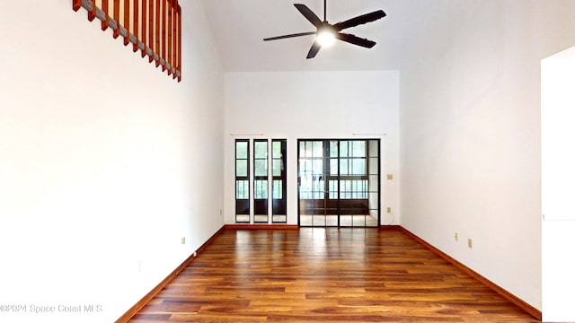 753 Greenwood Manor Cir Unit 15B, West Melbourne, FL 32904 - spare room with high vaulted ceiling, wood finished floors, a ceiling fan, and baseboards
