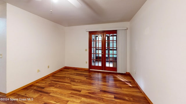 753 Greenwood Manor Cir Unit 15B, West Melbourne, FL 32904 - unfurnished room featuring wood finished floors, a ceiling fan, baseboards, and french doors