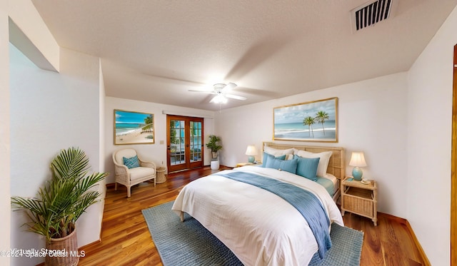 753 Greenwood Manor Cir Unit 15B, West Melbourne, FL 32904 - bedroom featuring french doors, access to exterior, wood finished floors, ceiling fan, and baseboards