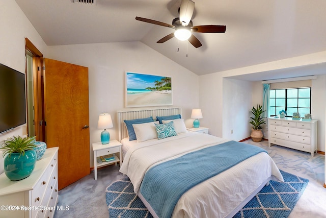 bedroom with light colored carpet, lofted ceiling, and ceiling fan