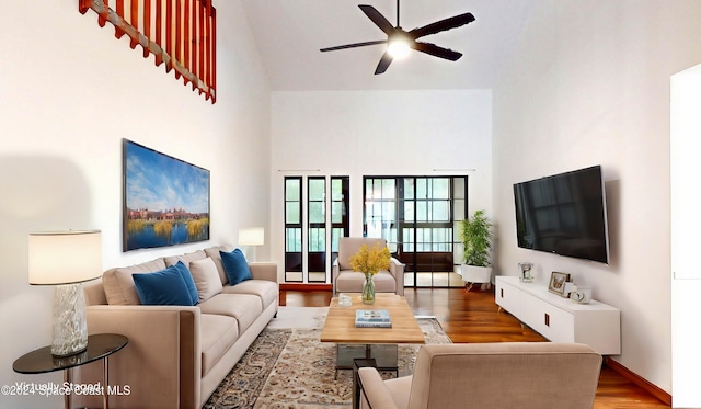 753 Greenwood Manor Cir Unit 15B, West Melbourne, FL 32904 - living area with high vaulted ceiling, ceiling fan, and wood finished floors
