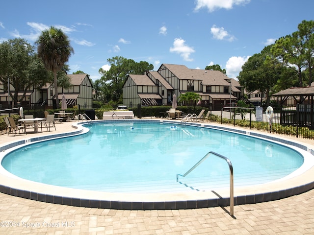 view of swimming pool featuring a patio area