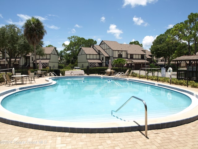 753 Greenwood Manor Cir Unit 15B, West Melbourne, FL 32904 - community pool with a residential view, a patio, and a gazebo