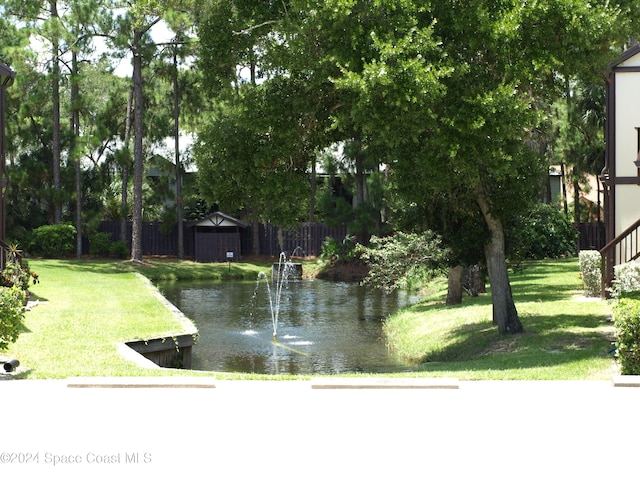 753 Greenwood Manor Cir Unit 15B, West Melbourne, FL 32904 - view of property's community featuring a yard and a storage shed