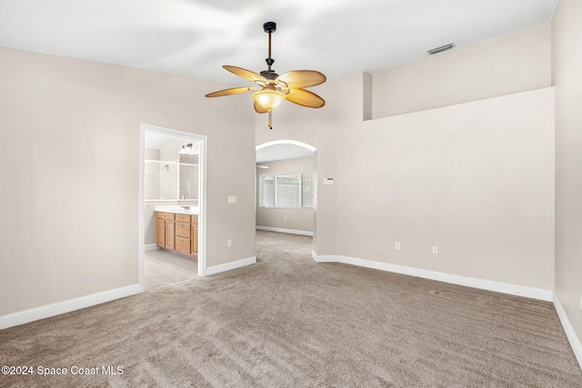 carpeted empty room with ceiling fan