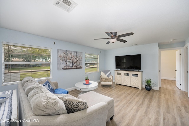 living room featuring ceiling fan and light wood-type flooring