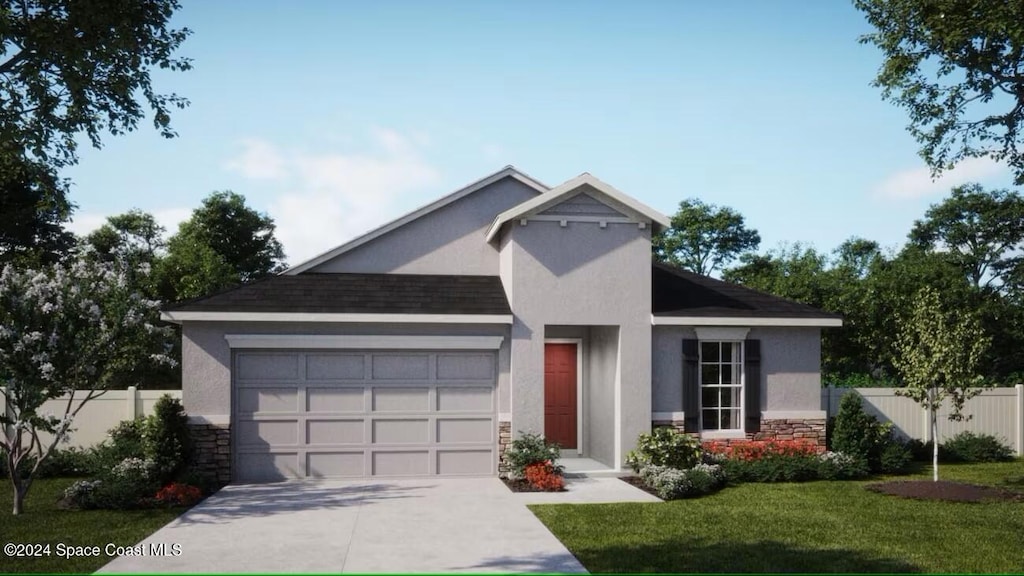 view of front of house featuring a front yard and a garage