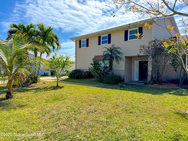 view of front of home featuring a front yard