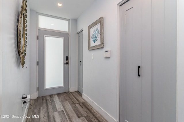 doorway to outside with hardwood / wood-style floors