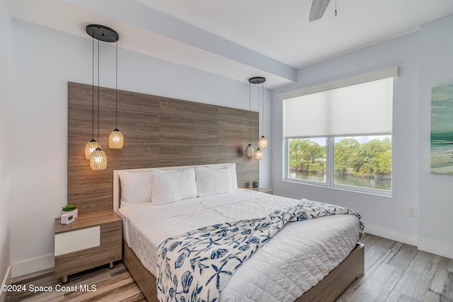 bedroom featuring hardwood / wood-style flooring and ceiling fan