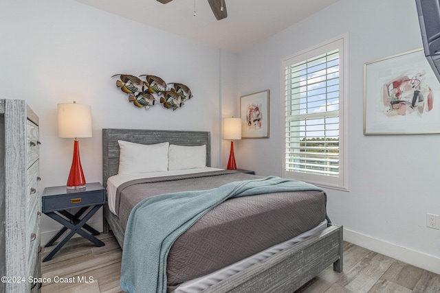 bedroom featuring ceiling fan and hardwood / wood-style flooring