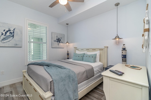 bedroom featuring dark wood-type flooring and ceiling fan