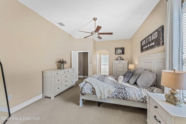 bedroom with light carpet and ceiling fan