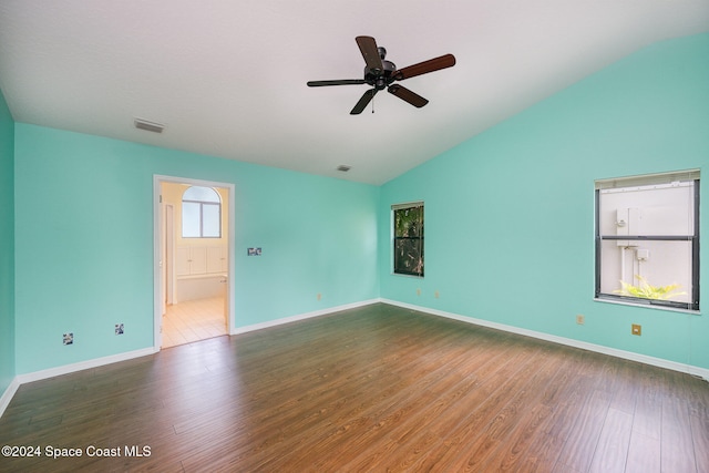 spare room with ceiling fan, lofted ceiling, and dark hardwood / wood-style flooring