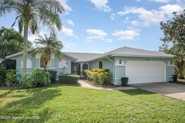 single story home with a garage and a front lawn